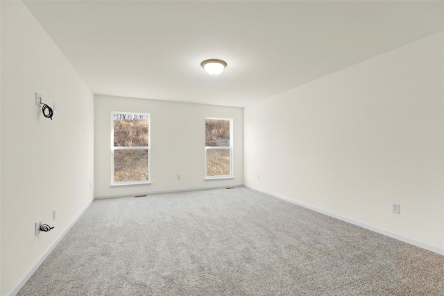 empty room featuring carpet flooring