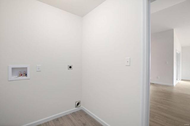 laundry room with hookup for a washing machine, light wood-type flooring, and hookup for an electric dryer