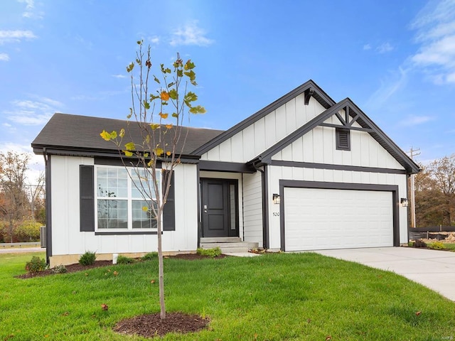 view of front of property with a front lawn and a garage