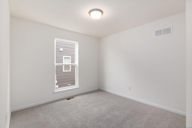 empty room with light colored carpet