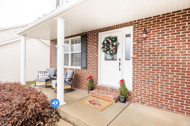 property entrance featuring a porch