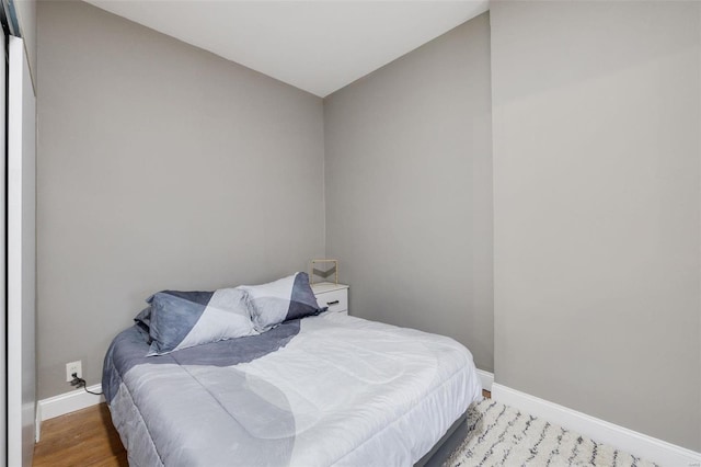 bedroom featuring hardwood / wood-style floors