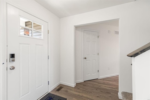 entryway featuring dark wood-type flooring