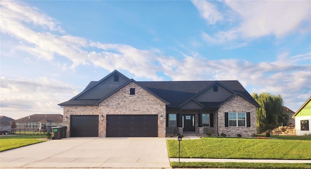 craftsman-style house featuring a garage and a front lawn