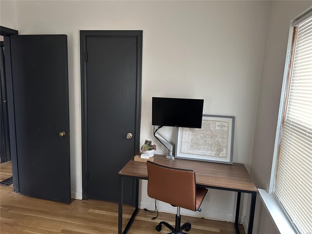 office space featuring light wood-type flooring