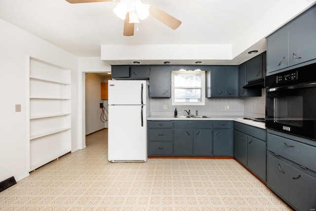 kitchen featuring backsplash, ceiling fan, sink, and white appliances