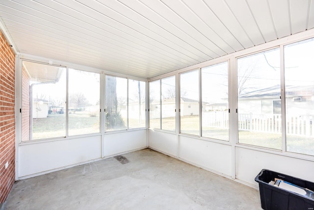 unfurnished sunroom featuring a wealth of natural light