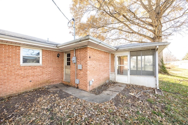 rear view of house with a sunroom