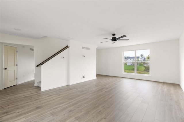 empty room featuring ceiling fan and light hardwood / wood-style flooring