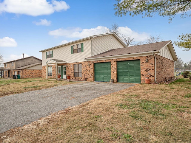 view of front of home with a garage and a front yard