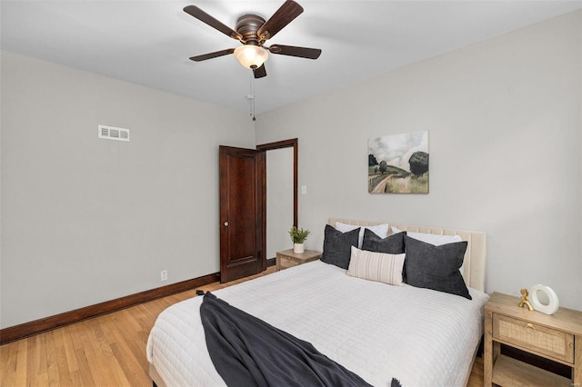 bedroom with wood-type flooring and ceiling fan