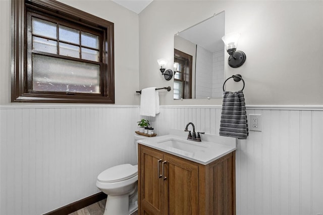 bathroom featuring hardwood / wood-style flooring, vanity, and toilet