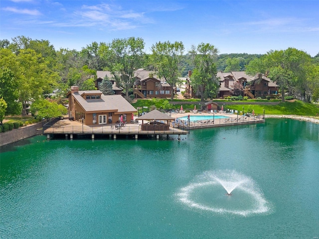 birds eye view of property with a residential view and a water view