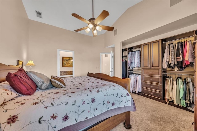 carpeted bedroom featuring high vaulted ceiling, a ceiling fan, visible vents, and a closet