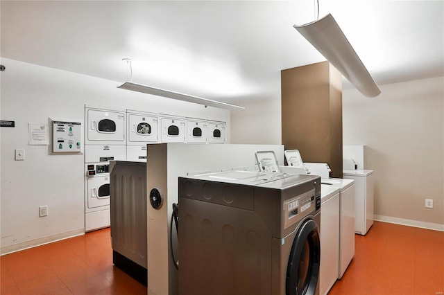 laundry area with stacked washer and dryer and washing machine and clothes dryer