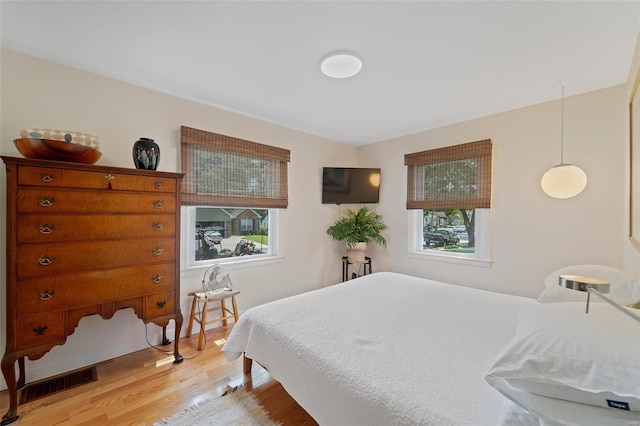 bedroom with light wood-type flooring