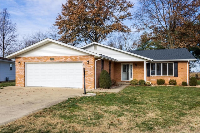 ranch-style home with a garage and a front yard