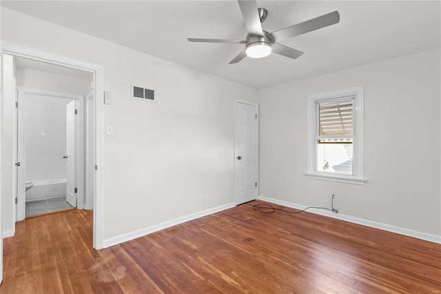 empty room with wood-type flooring and ceiling fan