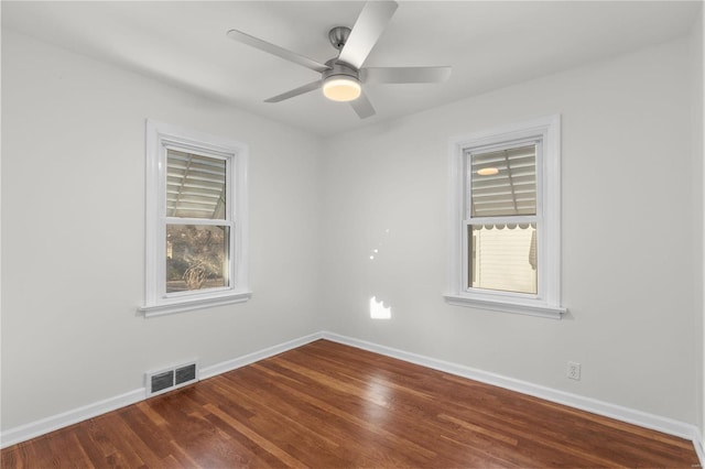 unfurnished room featuring hardwood / wood-style floors, ceiling fan, and a healthy amount of sunlight