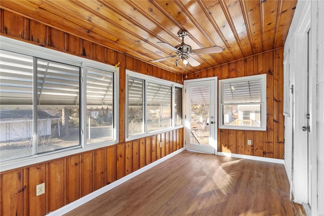 unfurnished sunroom with ceiling fan and wood ceiling