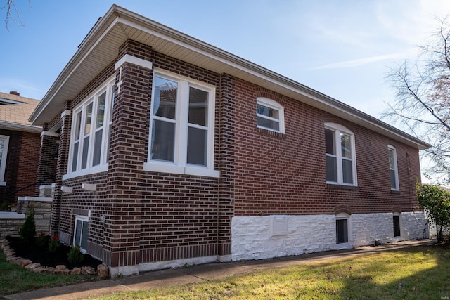 view of home's exterior featuring a lawn