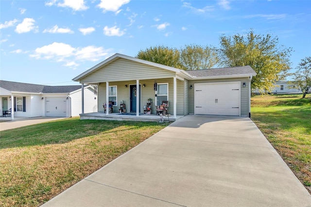 ranch-style house featuring a garage, covered porch, and a front lawn