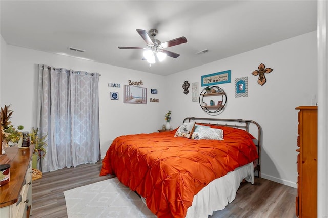 bedroom featuring ceiling fan and wood-type flooring