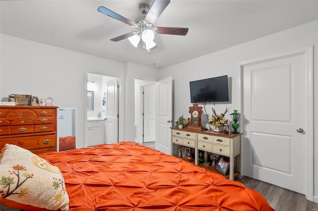 bedroom with light hardwood / wood-style flooring, ensuite bath, and ceiling fan