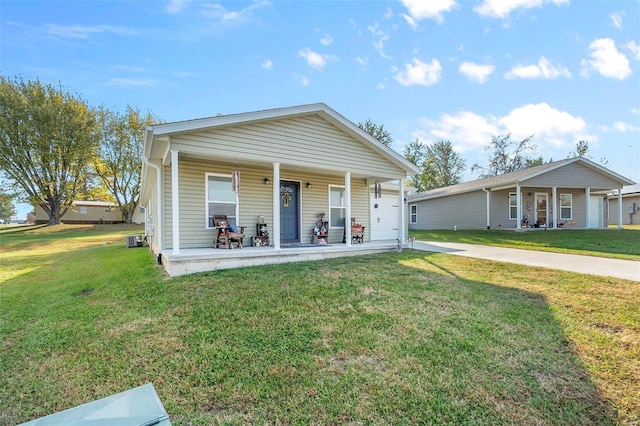 view of front of property featuring covered porch and a front yard