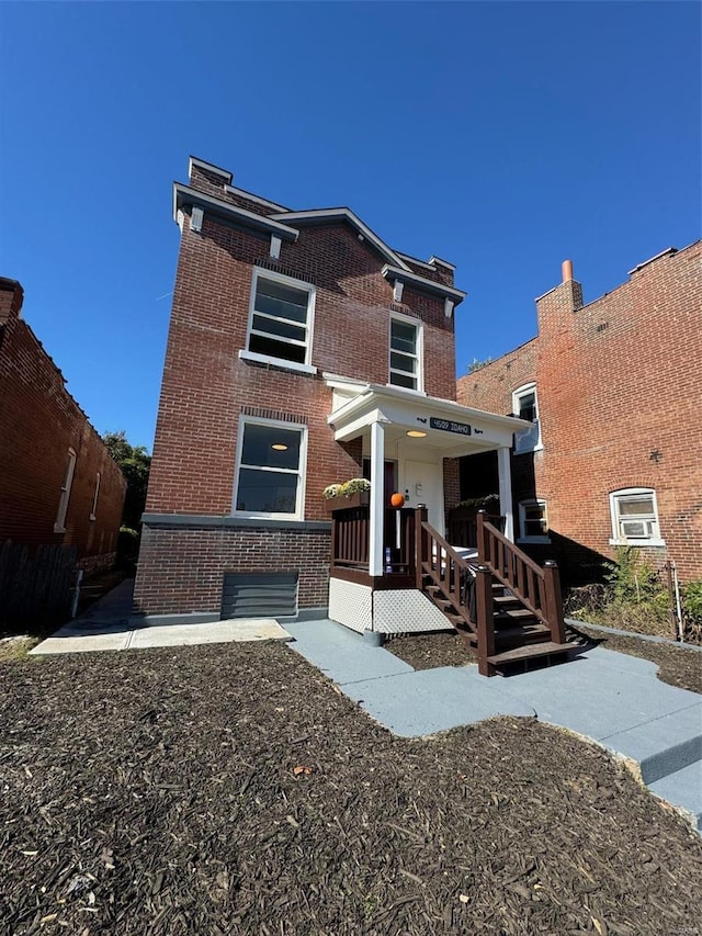 view of front of property featuring brick siding