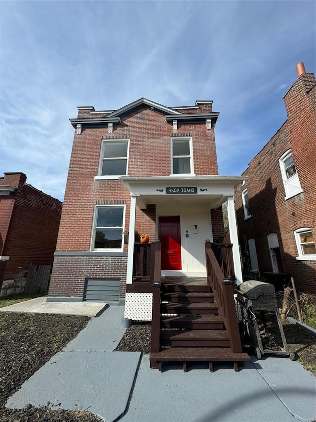 view of front of property featuring brick siding