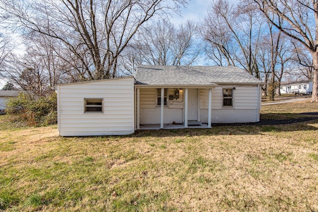 view of outbuilding with a yard