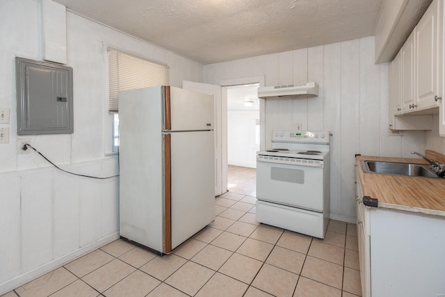 kitchen with white cabinetry, sink, electric panel, white appliances, and light tile patterned flooring