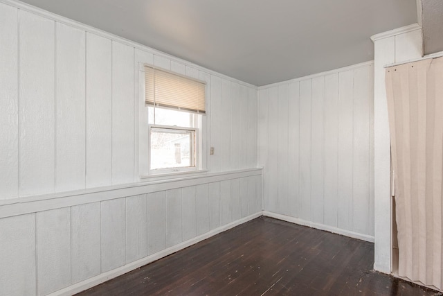 spare room with dark wood finished floors