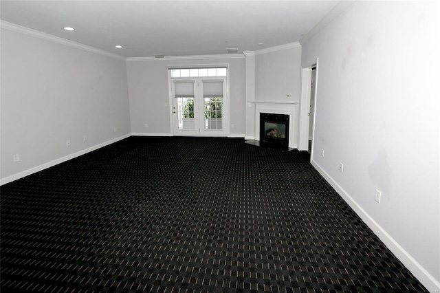 unfurnished living room featuring a fireplace, carpet floors, and ornamental molding