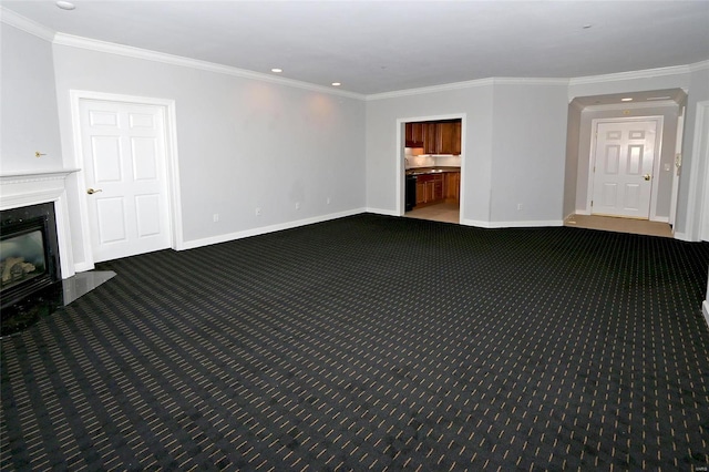 unfurnished living room with a high end fireplace, crown molding, and carpet floors