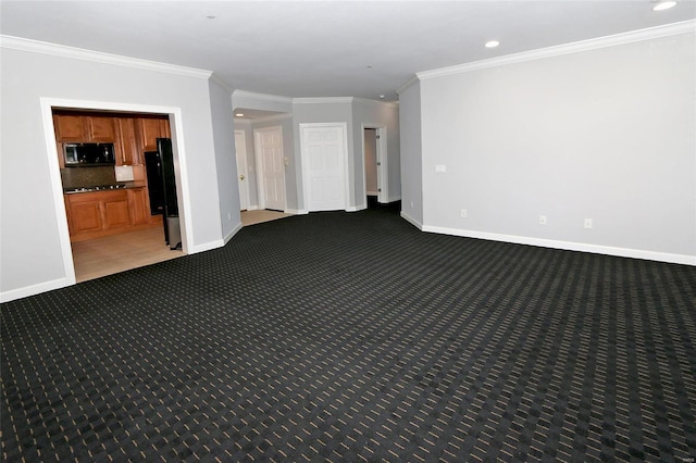 carpeted spare room with crown molding