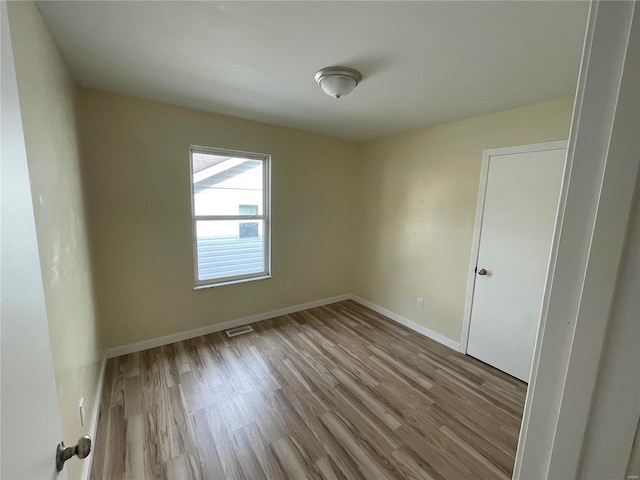 empty room with light wood-type flooring