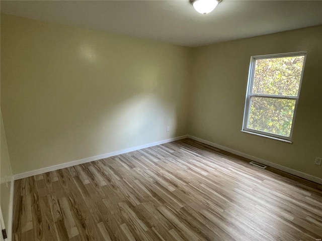 unfurnished room featuring light wood-type flooring