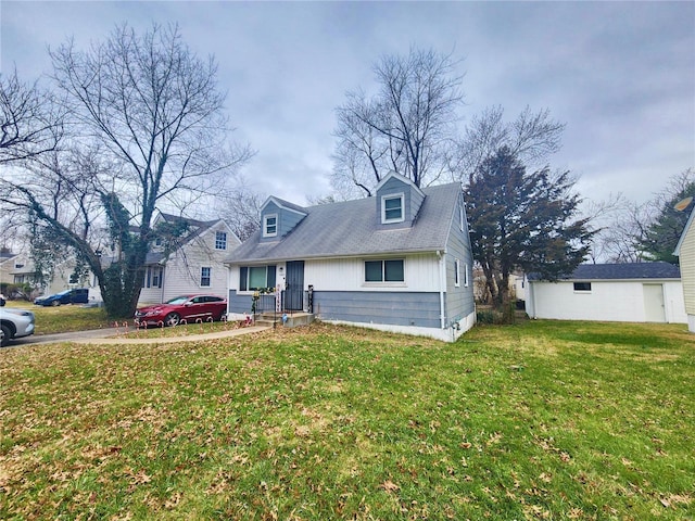 cape cod home featuring a front lawn