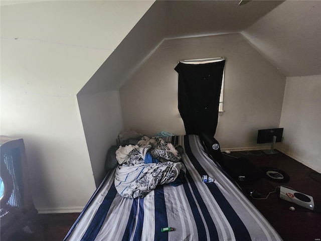 bedroom with lofted ceiling