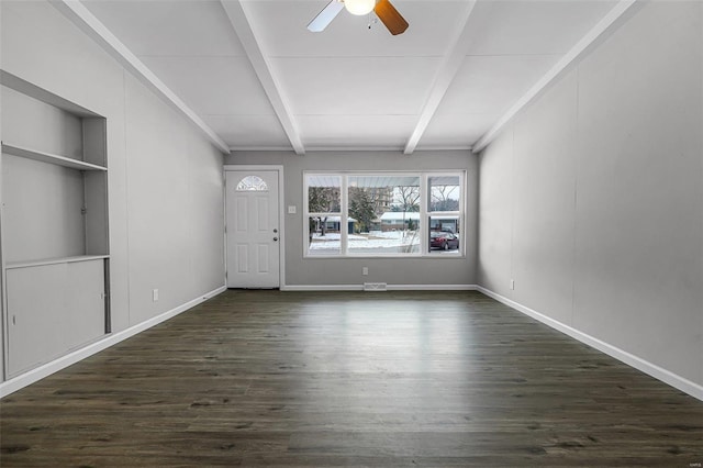 interior space with ceiling fan, dark hardwood / wood-style flooring, and beamed ceiling