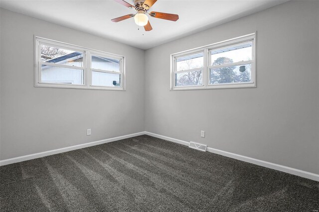 spare room with carpet flooring and ceiling fan