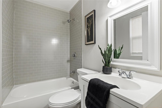 full bathroom with vanity, toilet, and tiled shower / bath combo