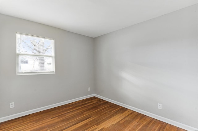 unfurnished room featuring dark hardwood / wood-style floors