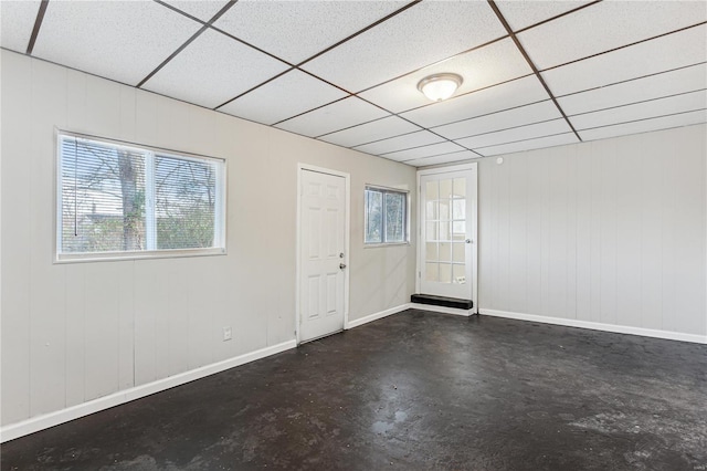 spare room with a drop ceiling