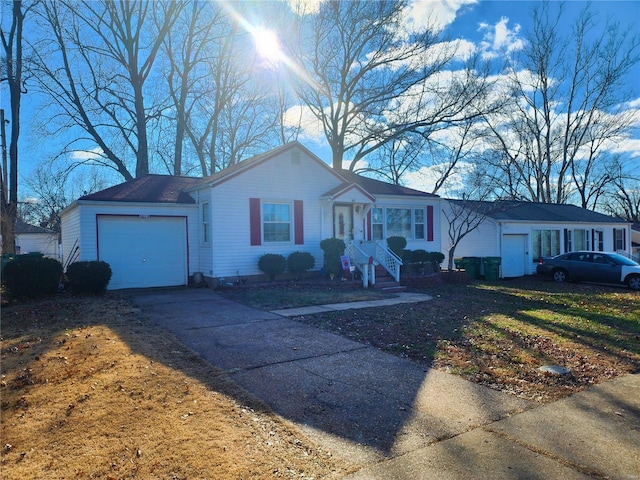 ranch-style home featuring driveway and an attached garage