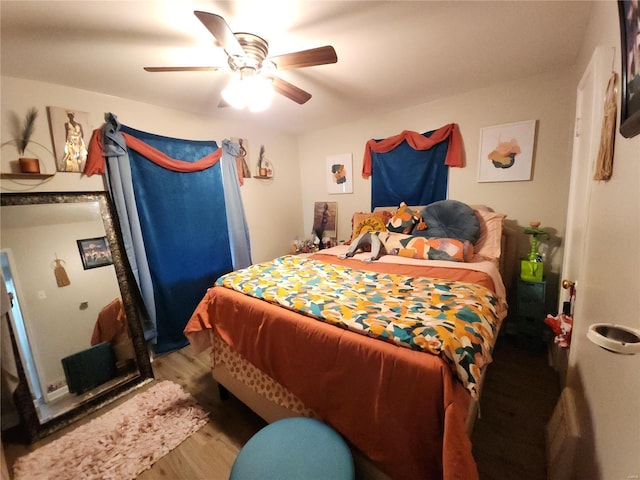 bedroom featuring ceiling fan and wood finished floors