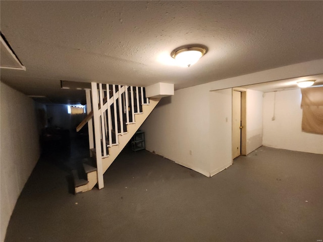 basement with a textured ceiling