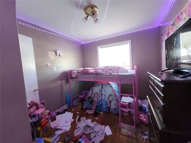 bedroom with dark wood-style floors